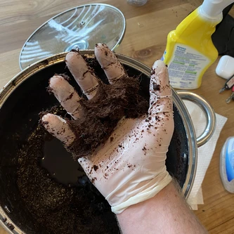 Showing squeezed (field capacity) coco coir in hand