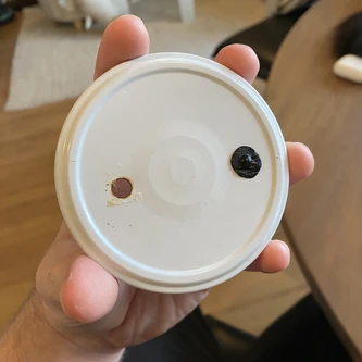 Top of lid with silicone dab and bump
